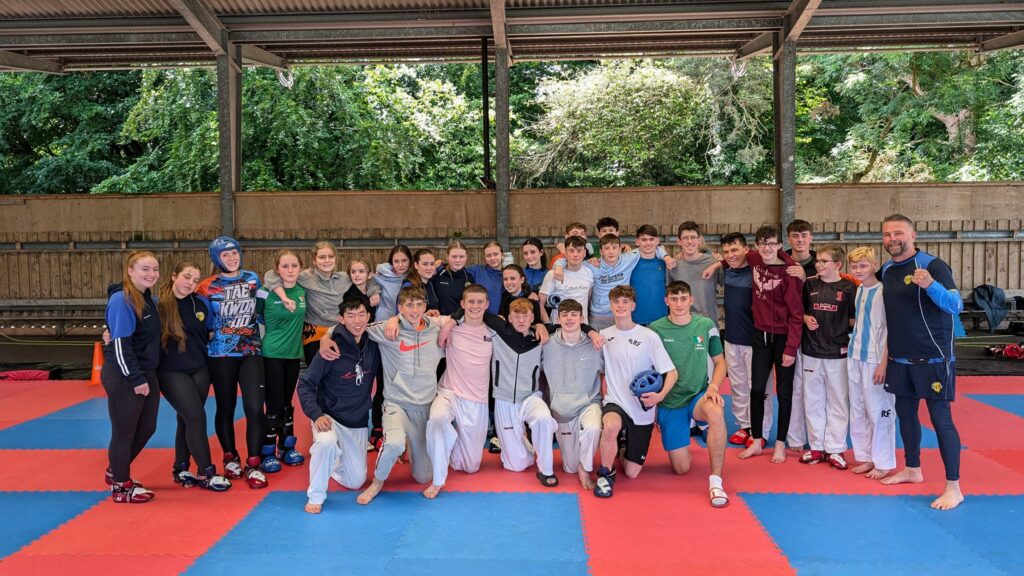 Elite Taekwon-Do NI students posing together after training